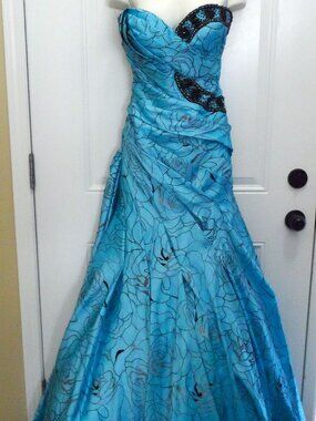 Tony Bowls mermaid gown  turquoise floral pattern  black beaded embellishments